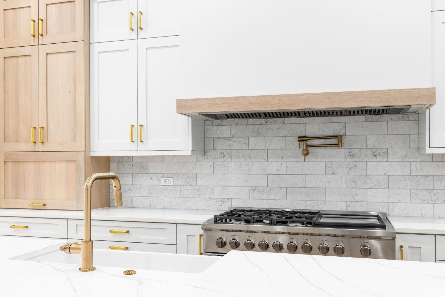 white spring texas kitchen remodel with gold fixtures