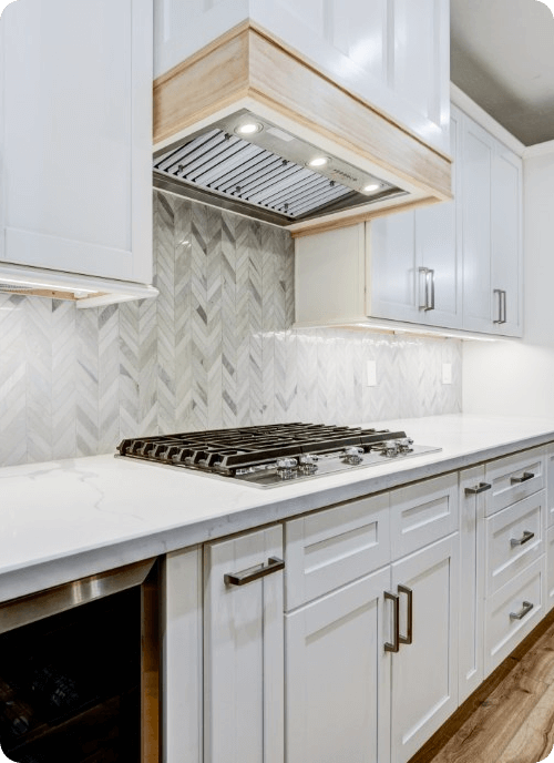 all white kitchen counter with stove and cabinets